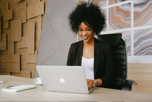 Online CHW training tools - African American woman in front of a computer